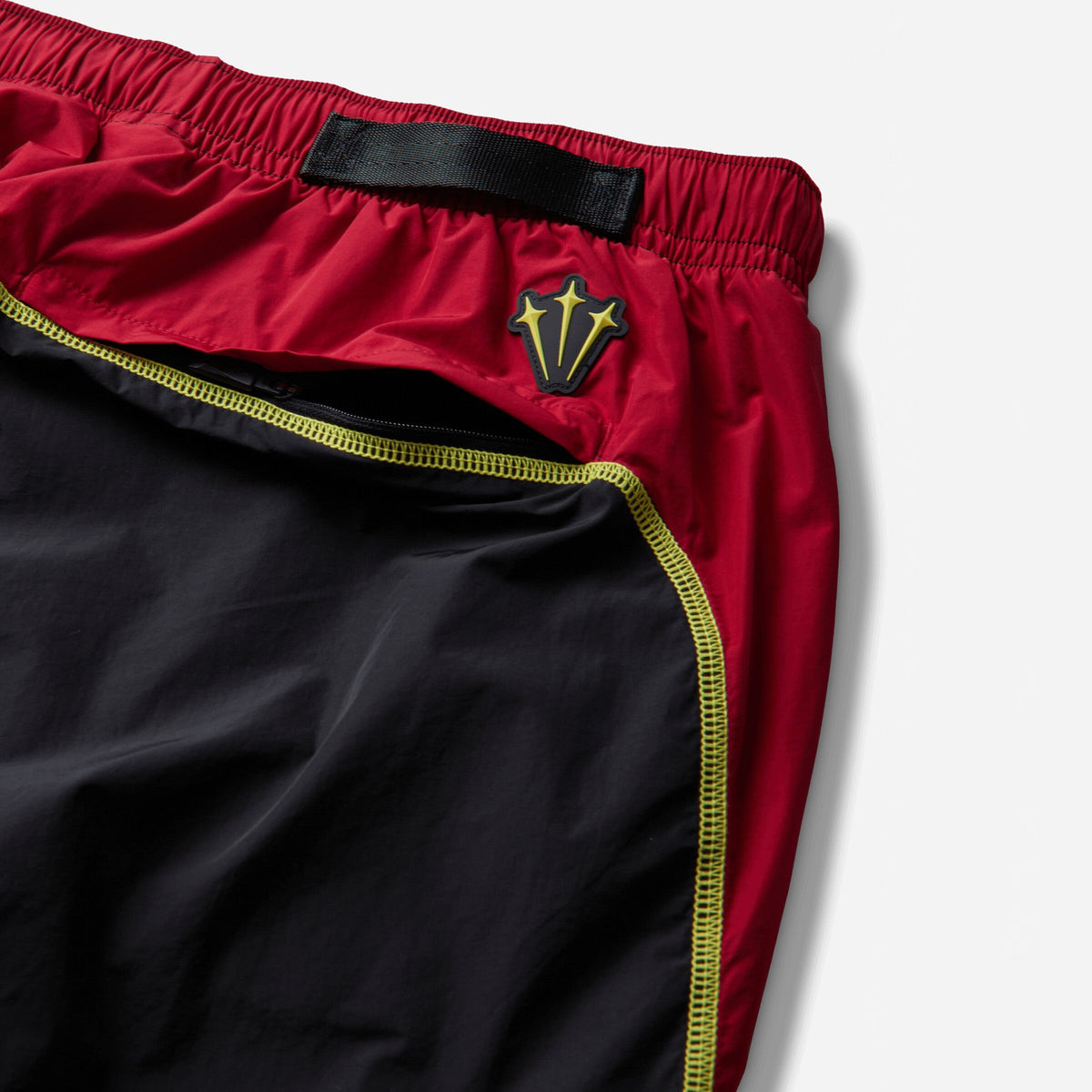 Nike Canada x NOCTA Woven Track Pants Black / Gym Red / Sonic Yellow