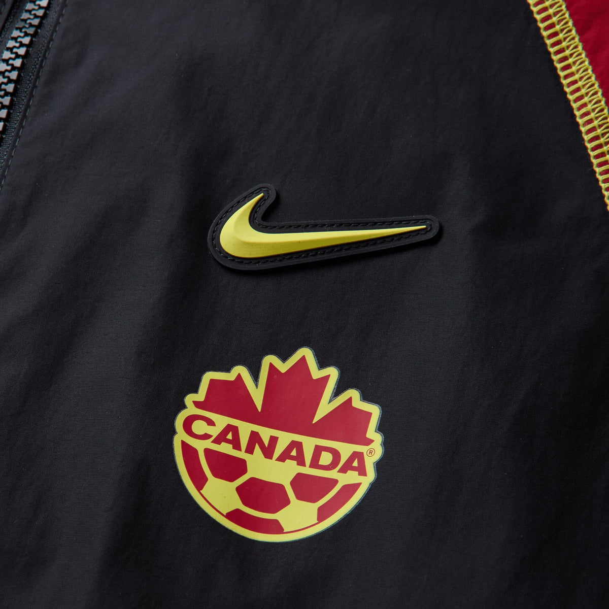 Nike Canada x NOCTA Woven Track Jacket Black / Gym Red / Sonic Yellow