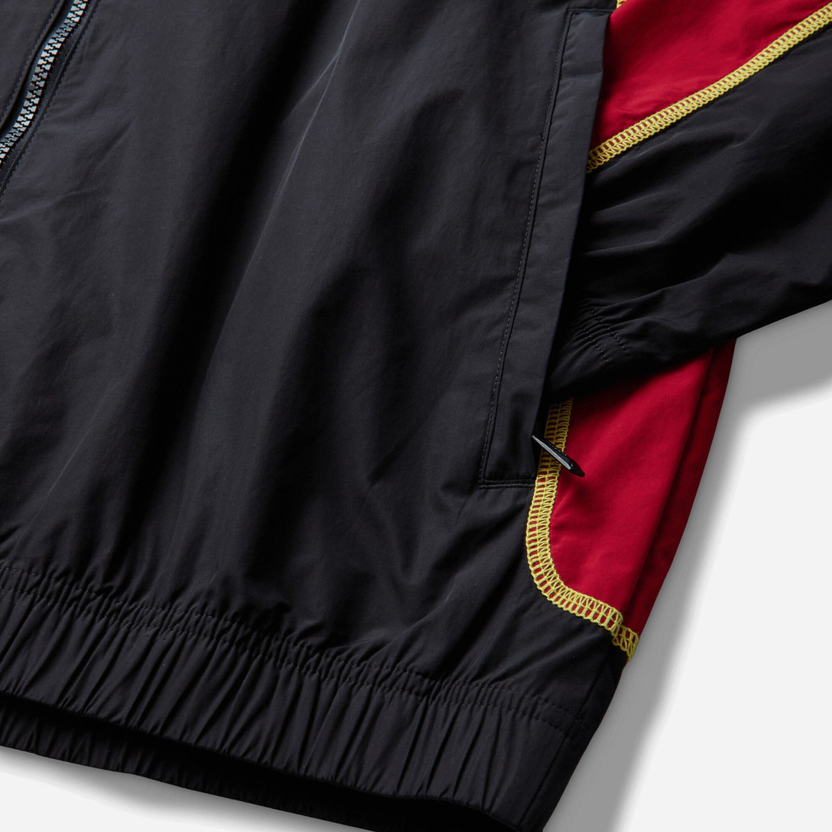 Nike Canada x NOCTA Woven Track Jacket Black / Gym Red / Sonic Yellow