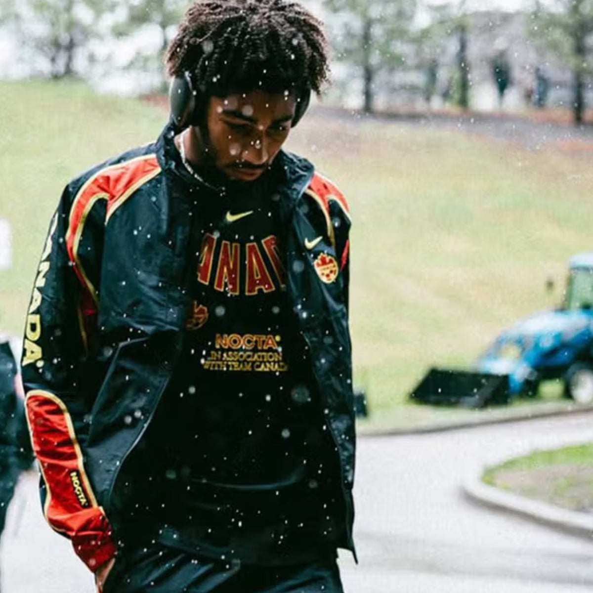 Nike Canada x NOCTA Woven Track Jacket Black / Gym Red / Sonic Yellow
